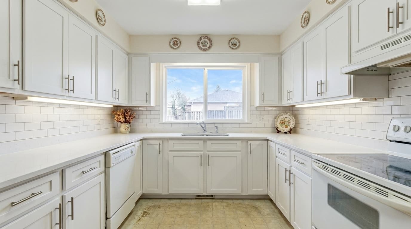Modern kitchen with white cabinets and quartz countertops